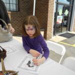 Painting her very own Meowna Lisa!